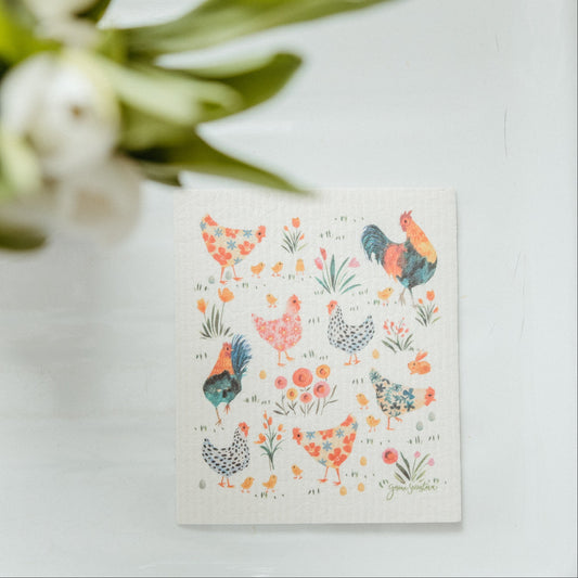 Dishcloth with chicken and floral pattern on a white surface